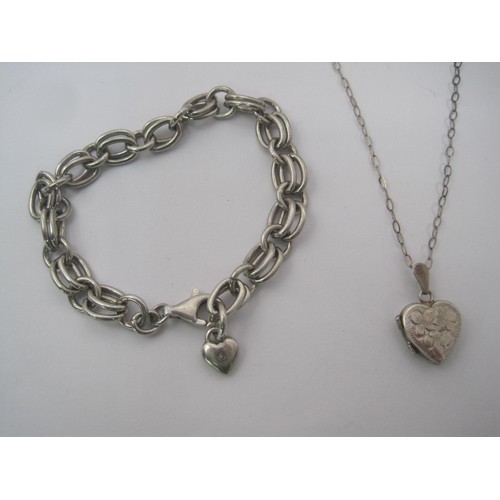 170 - A silver bracelet and a silver locket on chain. (1) A 925 silver bracelet of double chain links with... 