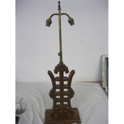 184 - A vintage table lamp, the wooden base Oriental in style