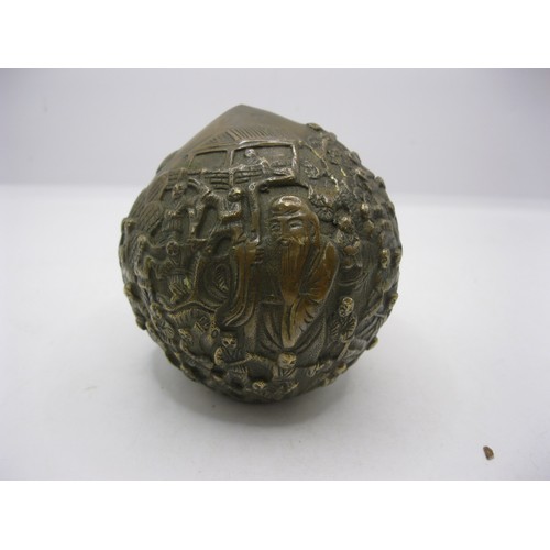 189 - An Oriental bronze decorative nut