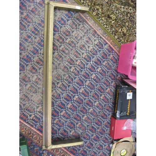 195 - An antique brass fire surround