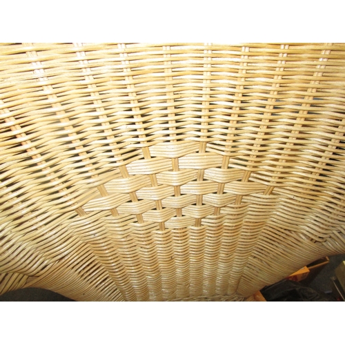 25 - Tree pieces of Rattan Furniture to include an easy chair and two casual tables one round and one rec... 