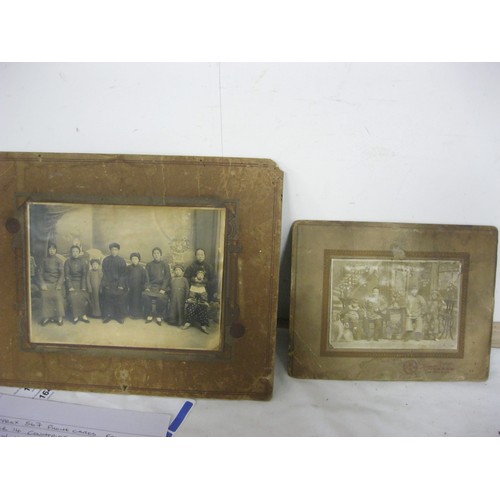 226 - A pair of antique photographs of Chinese families, one marked for Hsing Min with mainly Chinese char... 