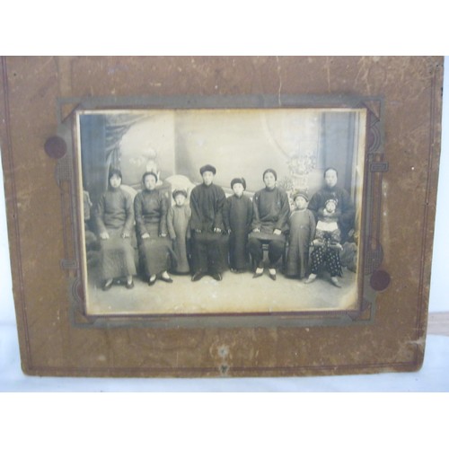 226 - A pair of antique photographs of Chinese families, one marked for Hsing Min with mainly Chinese char... 