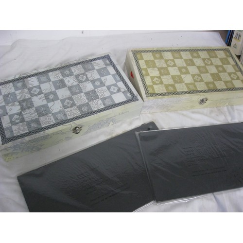 163 - A Lord of the Rings chess set, cased and in mint condition: 2 cases, one for black, one for white, t... 