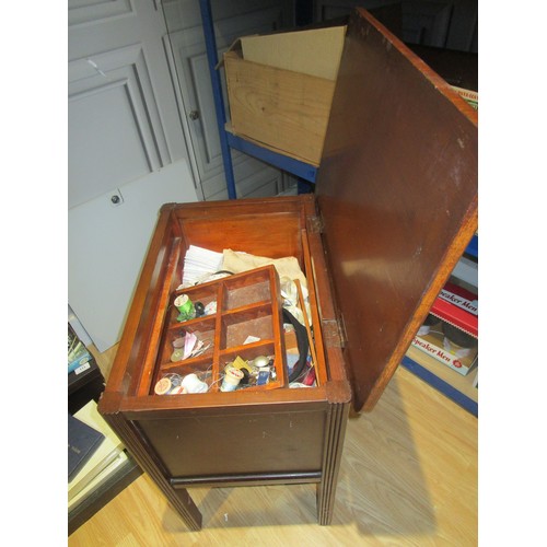 27 - A inter war or just post war  lidded Haberdashery or sewing box on legs complete with contents .