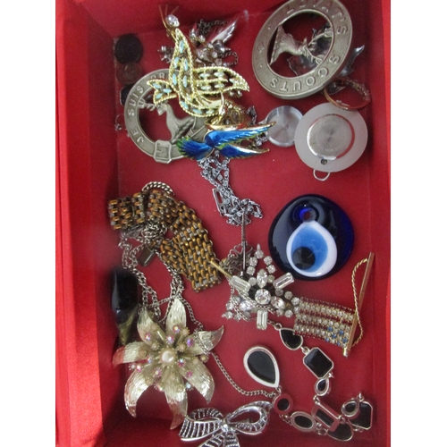 40A - A red jewellery box with a selection of costume jewellery including a stars and strips pin brooch.