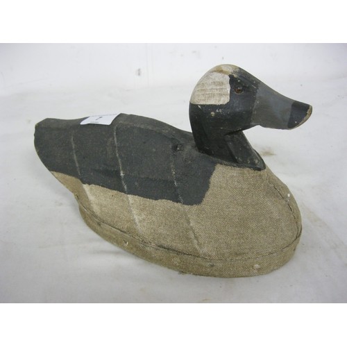 7 - A vintage wood and canvas painted duck decoy in good order