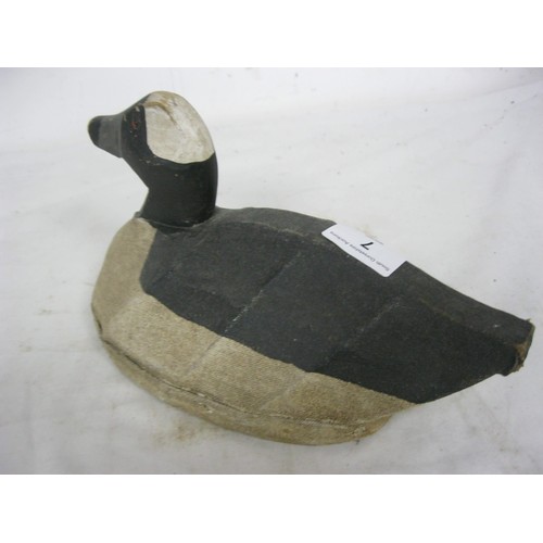 7 - A vintage wood and canvas painted duck decoy in good order