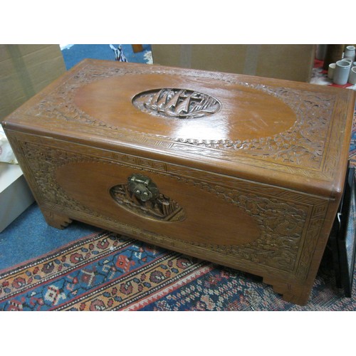 52 - A vintage Oriental camphorwood chest, nicely carved