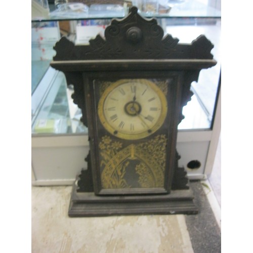 77 - An Ansonia 8 day clock, believed railway, in Gothic style, in running order