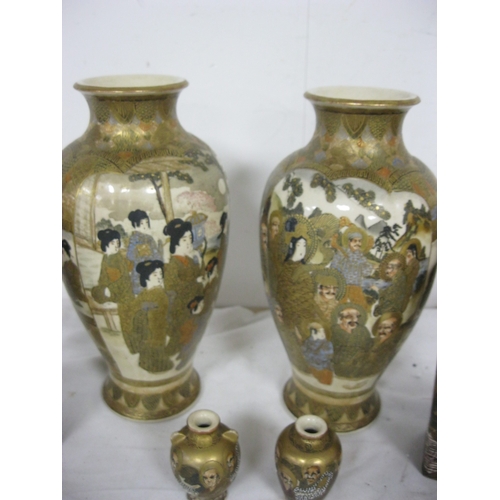 83 - A set of three pairs of matched Satsumaware vases, one of the small vases has a chip to base but oth... 