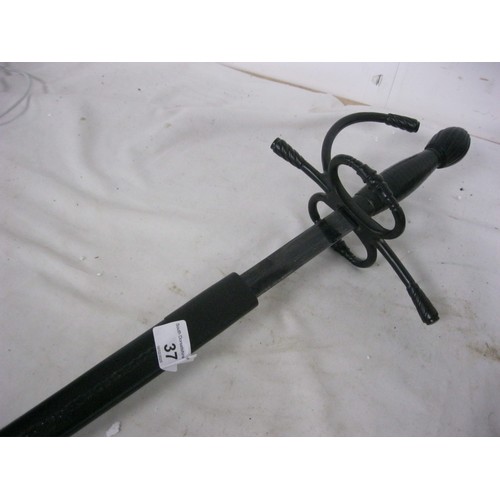 37 - A Spanish style sword in black leather metal bound scabbard