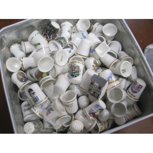 80 - Tin with a large assortment of porcelain Thimbles