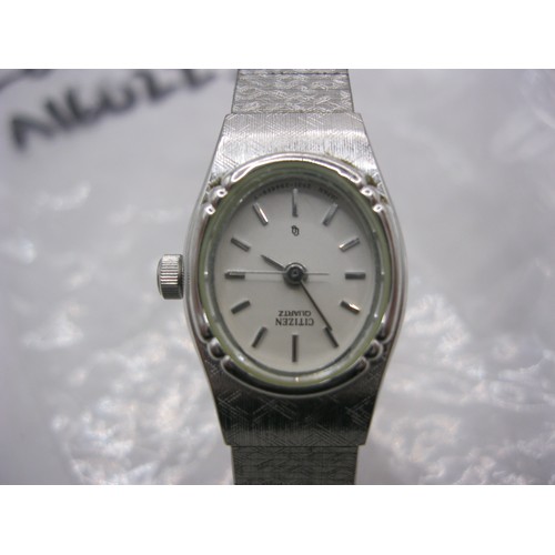 118 - A Citizen ladies quartz wristwatch with metal bracelet and safety chain. A/f requires new battery at... 