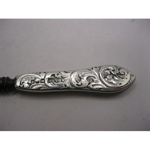 120 - An Andrew Barret & Sons of Piccadilly manicure tool with a silver clad handle. Stamped with the make... 