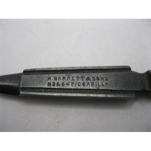 120 - An Andrew Barret & Sons of Piccadilly manicure tool with a silver clad handle. Stamped with the make... 