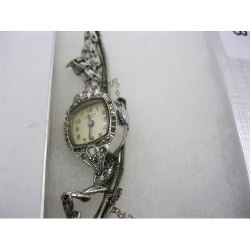 128 - An Ingersoll ladies cocktail mechanical wristwatch set with marcasite to the steel case and bracelet... 