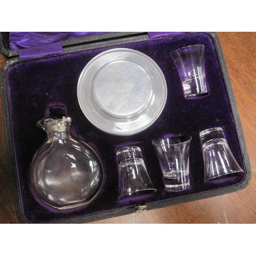 136 - A vintage communion travelling set comprising platters, wine jug and small glasses, all in a fitted,... 