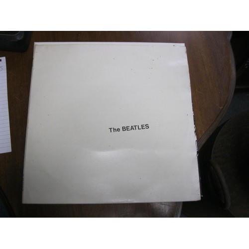 132 - the Beatles White Album on vinyl and a boxed set of Rod Stewart CDs