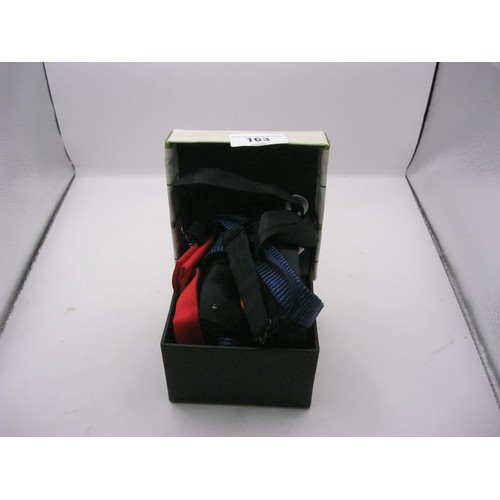 163 - A small box containing bow ties including a light-up example