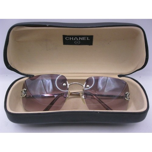 211 - A pair of Chanel sunglasses in hard case, in good order