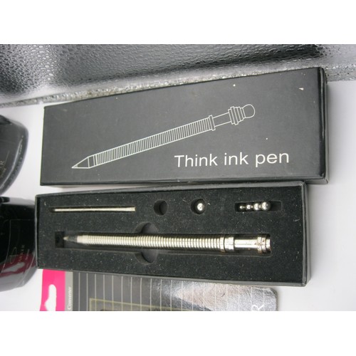 217 - A box containing a selection of pens and pen-related items including bottles of ink, cartridges etc.... 