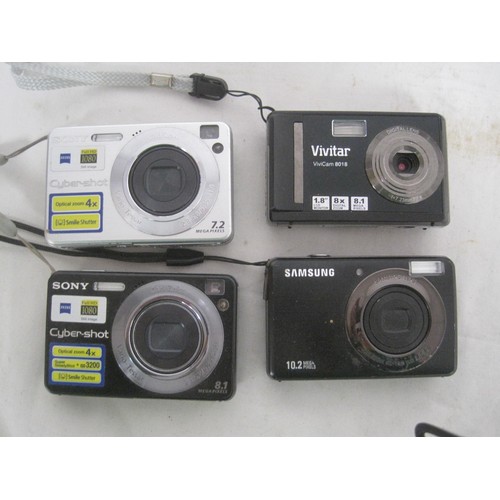 207 - A selection of digital cameras including Sony, Kodak, Olympus, and others, many with carry pouches