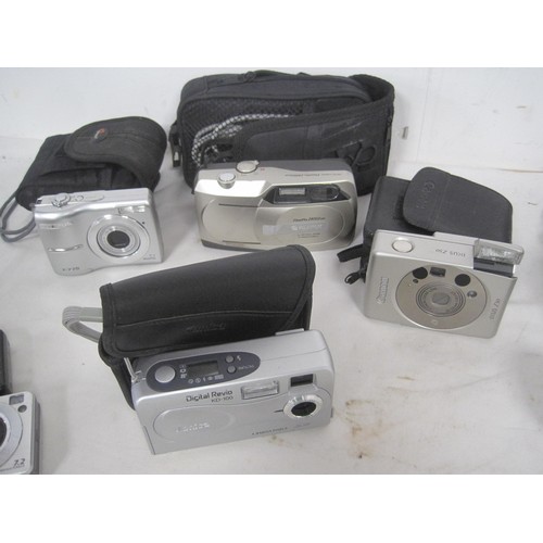 207 - A selection of digital cameras including Sony, Kodak, Olympus, and others, many with carry pouches