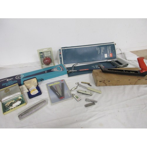 171 - An assortment of penknives, coins, a cricket ball, Smith's thermometer and several boxed saws