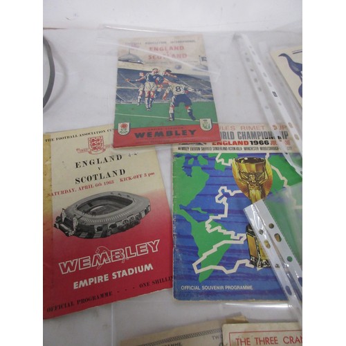 9 - An assortment of vintage football programmes including 1966 World Cup Official Souvenir Programme, 1... 