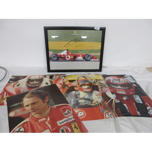 10 - A Michael Schumaker signed Ferrari picture, framed and glazed and in good order, and a number of lar... 