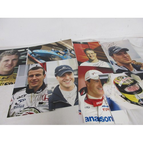 12 - A sheaf of signed photographs of Formula 1 drivers