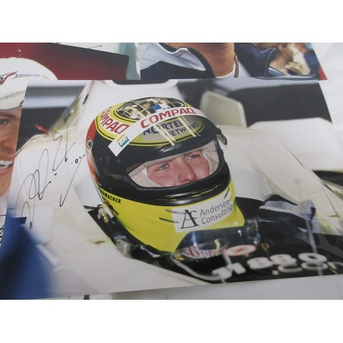 12 - A sheaf of signed photographs of Formula 1 drivers