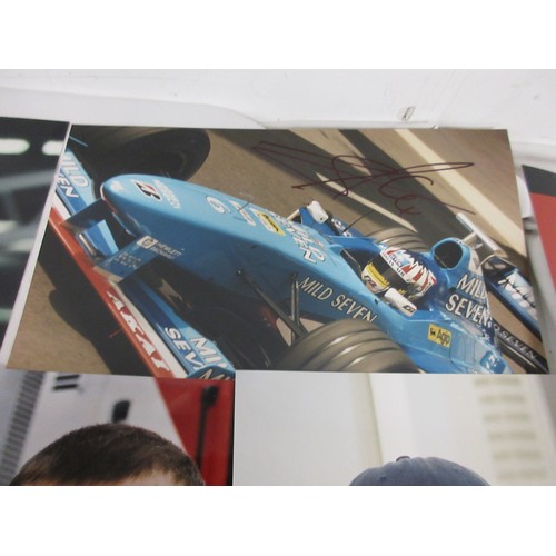 12 - A sheaf of signed photographs of Formula 1 drivers