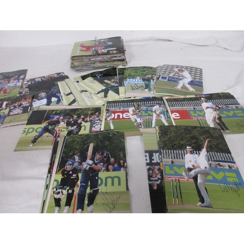 13 - A large box containing a quantity of signed photographs of cricketers