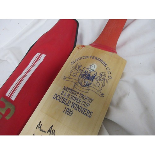 14 - A Hunts County cricket bat signed by the 1999 Gloucestershire Cricket Club double winning team