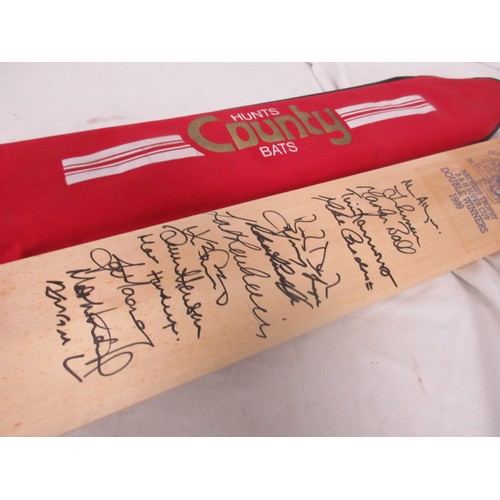 14 - A Hunts County cricket bat signed by the 1999 Gloucestershire Cricket Club double winning team