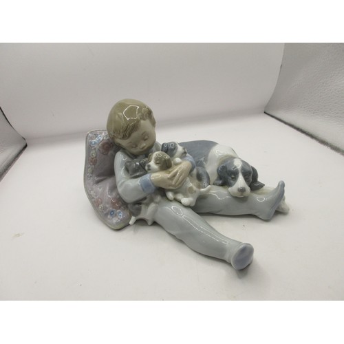 156 - Two Lladro figures - girl with book and dog 5475, height 15cm;  and 'Sweet dreams' boy with dog and ... 