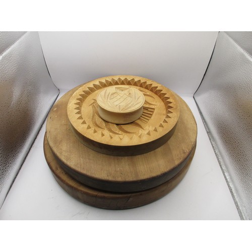 128 - Four wooden shortbread moulds, the largest diameter 31cm, the smallest 8cm