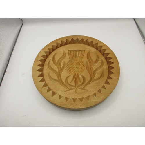 128 - Four wooden shortbread moulds, the largest diameter 31cm, the smallest 8cm