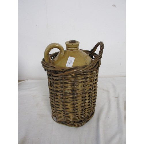 170 - A stoneware flagon for F Mitchell & Co Distillery Chard, in wicker basket