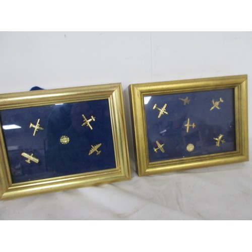 160 - A set of Bombardier aircraft pin badges in two small, gilt-effect frames.