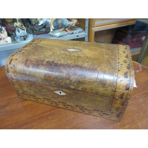 168 - An antique burr walnut writing slope with marquetry inlay and mother of pearl decoration, black tool... 