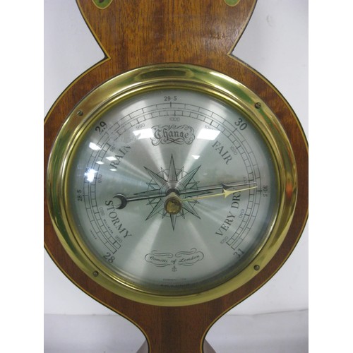 141 - A Comitti of London mahogany mounted aneroid banjo barometer. Height 67cm