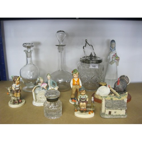 142 - A mixed lot of glass and china, including a biscuit jar with electroplated mounts, decanters, an a/f... 