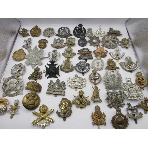 1 - A good selection of mainly WW1 military cap badges including Artists' Rifles, Motor Machine Gun Corp... 