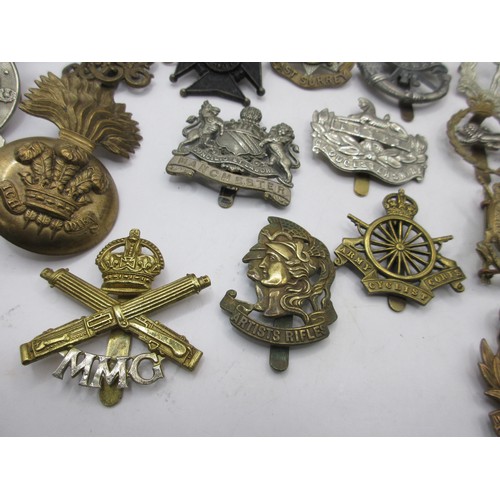 1 - A good selection of mainly WW1 military cap badges including Artists' Rifles, Motor Machine Gun Corp... 