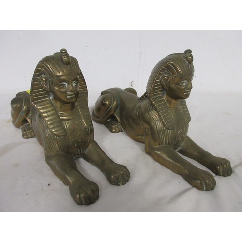 50 - An antique matching pair of heavy cast brass Sphinx in very nice order