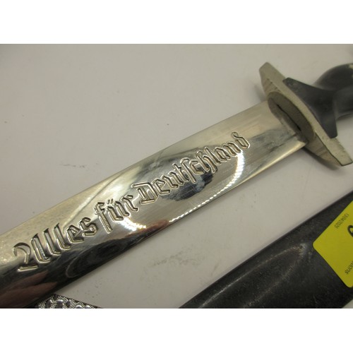 A reproduction SS dagger with chain, SS runes and swastika and eagle to ...