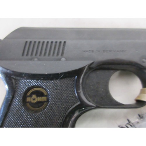 A Rohiti RG2s blank firing starting pistol with a small bag of blanks